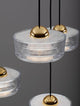 Keros LED Pendelleuchte 5-flammig 3000K Gold mit elegantem goldenen Deckel und klarem Glasdesign.