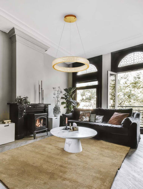 Kinara pendant light Ø 60cm 3000K Gold in an elegant living space with a cozy atmosphere.