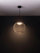 Kinetic LED Pendelleuchte 3000K Schwarz in elegantem Design mit modernem Drahtgeflecht und warmem Licht.
