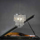 Kronleuchter Luxoria 6-flg. Chrom, Transparent über einem Klavier, elegante Beleuchtung für stilvolle Räume.