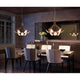 Kundalini LED Designleuchte Peacock mit 12 Armen Ø 80cm im eleganten Esszimmer