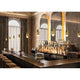 Kundalini Pendelleuchte Yuma 25,5cm Messing in stilvollem Bar-Ambiente mit eleganter Beleuchtung.