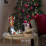 LED Decorative hot air balloon light with music & 13 multicolored LEDs in a cozy Christmas setting.