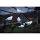 LED Acryl Vögel 5er-Set 40 Kaltweiß 24V auf einem Baum bei Nacht, strahlendes Licht in winterlicher Atmosphäre.