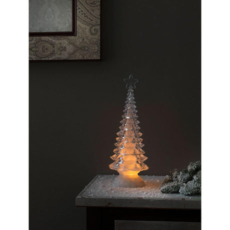 LED Acryl Weihnachtsbaum rotierend 3 Warmweiße Diode batteriebetrieben leuchtet sanft auf einem Tisch.