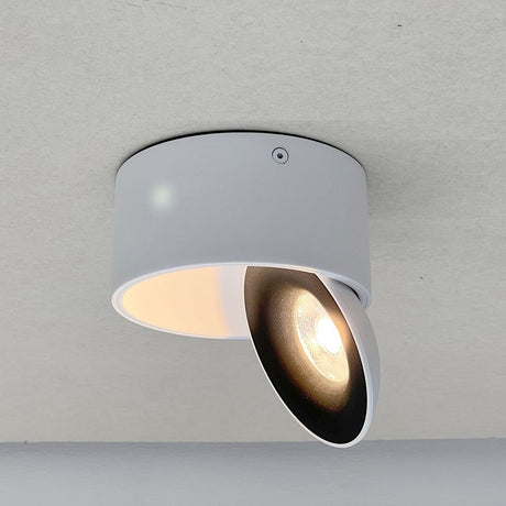 Dimmbarer LED Aufbauspot in elegantem Design mit schwenkbarem Reflektor für gezielte Beleuchtung.