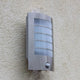 LED Außen-Wandlampe Slim mit Sensor IP44 Edelstahl an einer Wand montiert