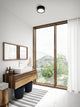 LED Wand- & Deckenlampe Ava Smart IP54 installiert in modernem Badezimmer mit Fenster und Holzmobiliar.