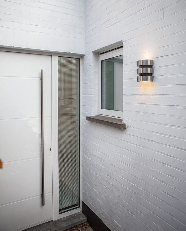 LED Maya outdoor light IP44 stainless steel with motion sensor on a white wall next to the front door.