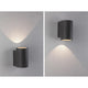 Beton LED Außenwandleuchte Concrea Sandig-Schwarz IP65 an grauer Wand mit indirektem Licht.