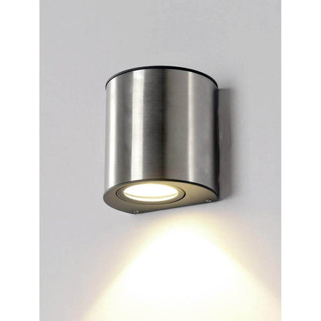 LED Outdoor wall light Ilumi IP54 chrome mounted on a wall with modern design and warm light.
