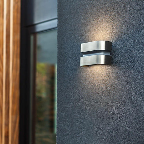 LED Maya outdoor wall light IP44 stainless steel in a modern design mounted on a wall, emits light upwards and downwards.