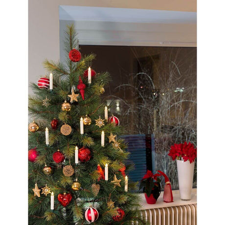 LED Tree lighting 10 wireless white candles remote control warm white battery-operated on a decorated Christmas tree.