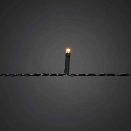 LED Baummantel mit Ring Ø 15cm 8 Stränge 50 Dioden Multifunktion App-gesteuert IP44 auf schwarzem Hintergrund.