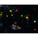 LED Biergartenkette 20er bunt 160 Warmweiße Dioden 24V im dunklen Garten mit stimmungsvollem Licht.