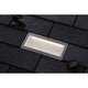 LED Bodeneinbauleuchte Brick mit Bewegungsmelder IP67 auf dunklem Untergrund mit Blättern.