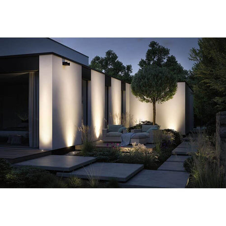 LED Floor recessed light Floor metal gray IP67 in a modern outdoor area with warm white light.