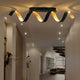 LED Deckenleuchte Helix Goldfarben, Schwarz in einem modernen Raumdesign