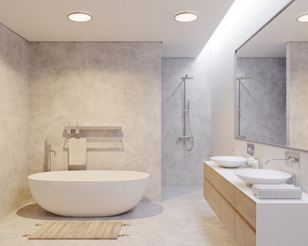 Moderne Badezimmeransicht mit LED Deckenleuchte Oja 42 3-Stufen IP54 über der Badewanne.