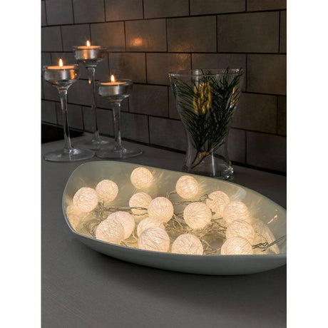 LED Decorative string lights with small white cotton balls, 16 warm white diodes in a decorative arrangement with candles.
