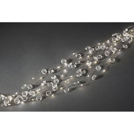 LED Diamantenlametta 10 Stränge mit 9 Dioden 90 Warmweiße Dioden auf schwarzem Hintergrund.