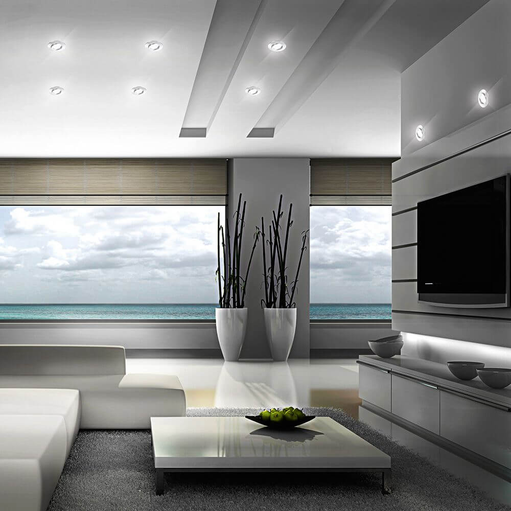 Modernes Wohnzimmer mit LED Einbauleuchte Movibile IP44 Chrom, eleganter Möbelgestaltung und Meerblick.