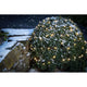 LED Globelichterkette runde Dioden 160 Warmweiße Dioden IP44 auf einem schneebedeckten Busch im Garten.