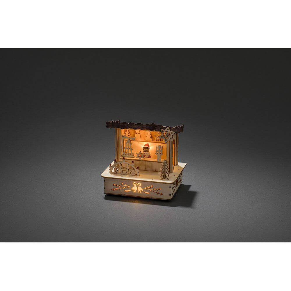 LED Holzsilhouette naturfarben Marktstand mit braunem Dach 3 Warmweiße Dioden batteriebetrieben in stimmungsvollem Licht.