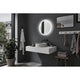 LED HomeSpa Leuchtspiegel Mirra CCT + Heizfunktion im modernen Badezimmer mit runder Form und eleganter Beleuchtung.