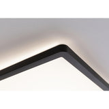 Eckansicht des LED Panels Atria Shine in Schwarz mit sanftem warmweißen Licht.