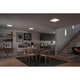 LED Panel Decken- & Wandleuchte Atria Shine in 3 Stufen-Dimmbar in modernem Wohnraum mit Tisch und Stühlen.