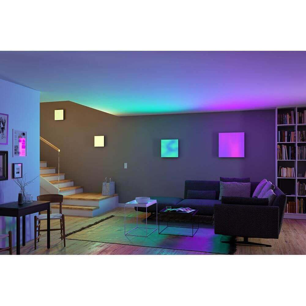 Modernes Wohnzimmer mit LED Panel Velora Rainbow, farbenfrohe Beleuchtung und stilvoller Einrichtung.