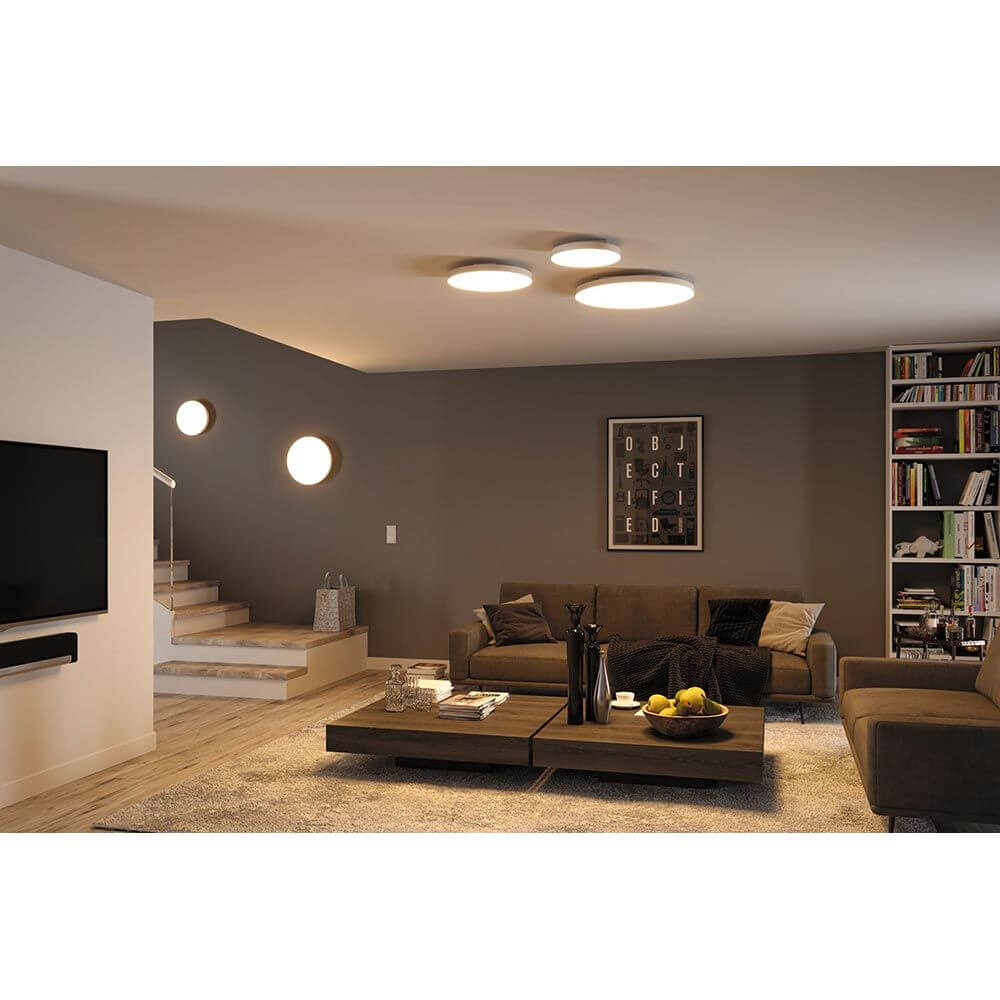 LED Aufbaupanel Velora Dim-to Warm CCT in modernem Wohnzimmer mit Deckenmontage und angenehmem Raumlicht.