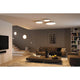 LED Aufbaupanel Velora Dim-to Warm CCT in modernem Wohnzimmer mit Deckenmontage und angenehmem Raumlicht.