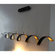 LED Pendelleuchte Helix Goldfarben, Schwarz in geschwungener Form mit goldfarbener Innenseite