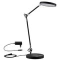 LED Schreibtischlampe Numis in Schwarz mit induktivem Ladefuß, dimmbar und verstellbaren Gelenken.