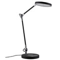 LED Schreibtischlampe Numis in Schwarz mit dimmbarem Licht und induktivem Laden.