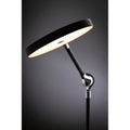 Schwarze dimmbare LED Schreibtischlampe Numis mit induktivem Laden und verstellbarem Gelenk.