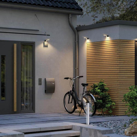 LED Solar bollard light Soley with sensor IP44 3000K anthracite installed on a modern house