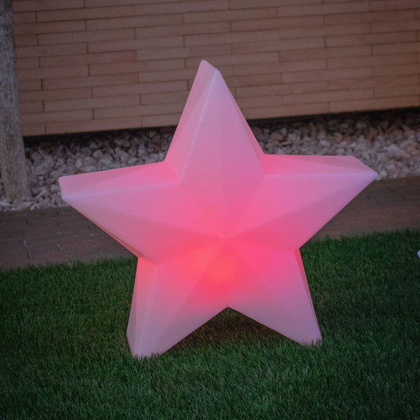 LED Stella Nova Akku + Solar IP65 stella luminosa in luce rosa in giardino.