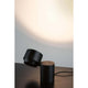 LED Wand- & Tischleuchte Puric Pane mit Touch-Dimmer Schwarz auf einem Tisch mit sanfter Lichtprojektion