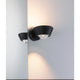 LED Wandleuchte Sabik Dimmbar Schwarz an der Wand, strahlt Licht nach oben und unten aus.