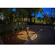 LED Wegelampe AGRA 10W 3000K 65cm IP54 beleuchtet einen Gartenweg bei Nacht.