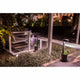 LED Wegelampe GROW 65cm 10W IP65 Dunkelgrau im Außenbereich mit stilvollen Pflanzen und Gartenmöbeln