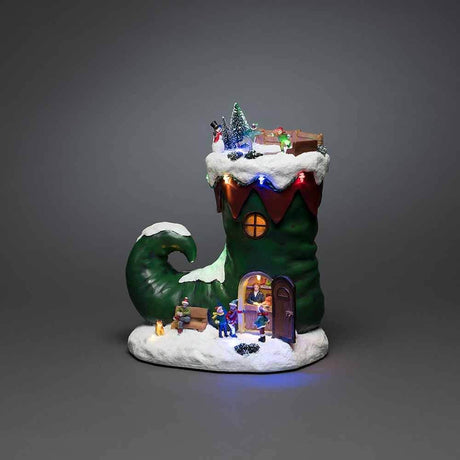 LED Christmas boot decorative light with music, battery-operated, festively decorated with figures and lights.
