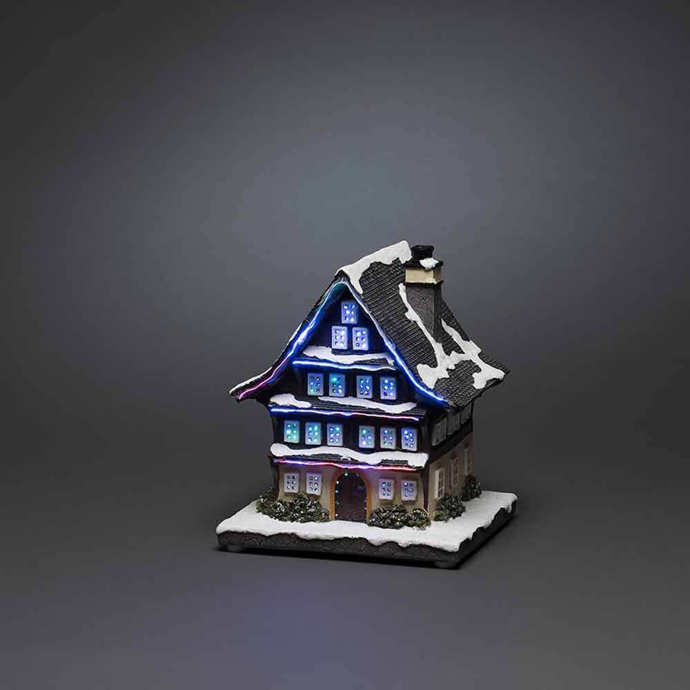 LED Winterhaus batteriebetrieben & 3 mehrfarbigen Leuchtdioden auf grauem Hintergrund.