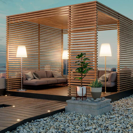 Terrace floor lamp Lola 177cm in a modern outdoor area with a cozy seating corner.
