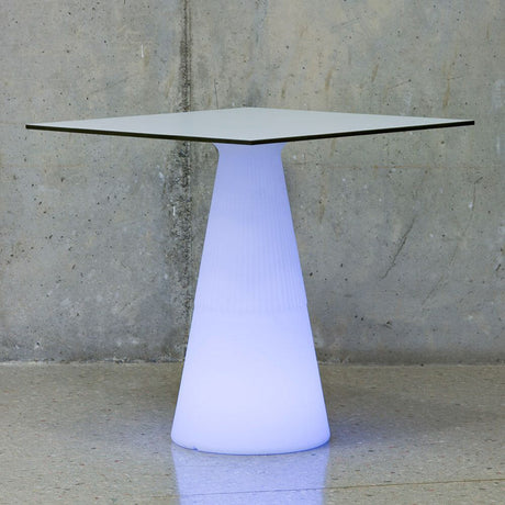 LED illuminated solar table Itaca with rechargeable battery and remote control on a modern surface.