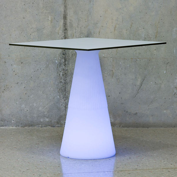 LED table solaire lumineux Itaca avec batterie et télécommande sur un support moderne.