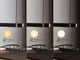Lilt LED Pendelleuchte mit dreistufigem Lichtdimmer, Beleuchtungseinstellungen 100%, 40%, 10%.